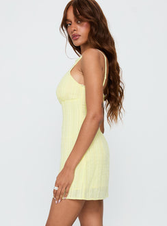side view of model wearing Princess Polly I Know Places Mini Dress Lemon Scoop Neck 