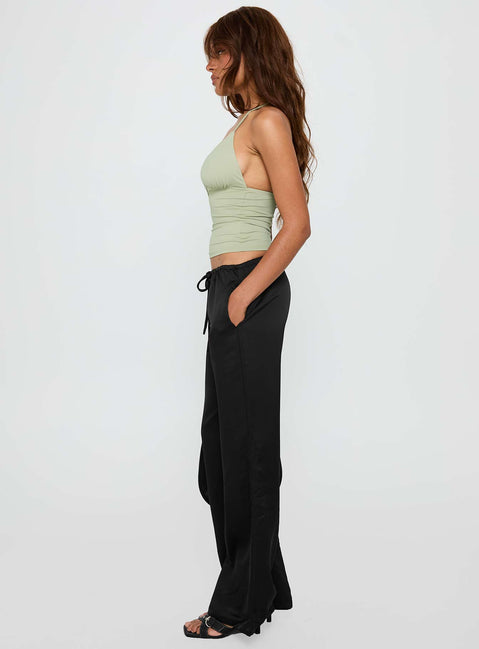 side view of model wearing Princess Polly Vanille Tie Waist Satin Pants Black Low Rise Pants 