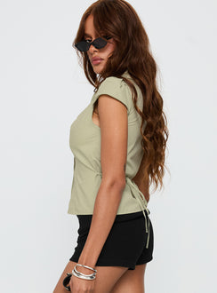 side view of model wearing Princess Polly Arianwyn Short Sleeve Shirt Sage Short Sleeves V-Neck 