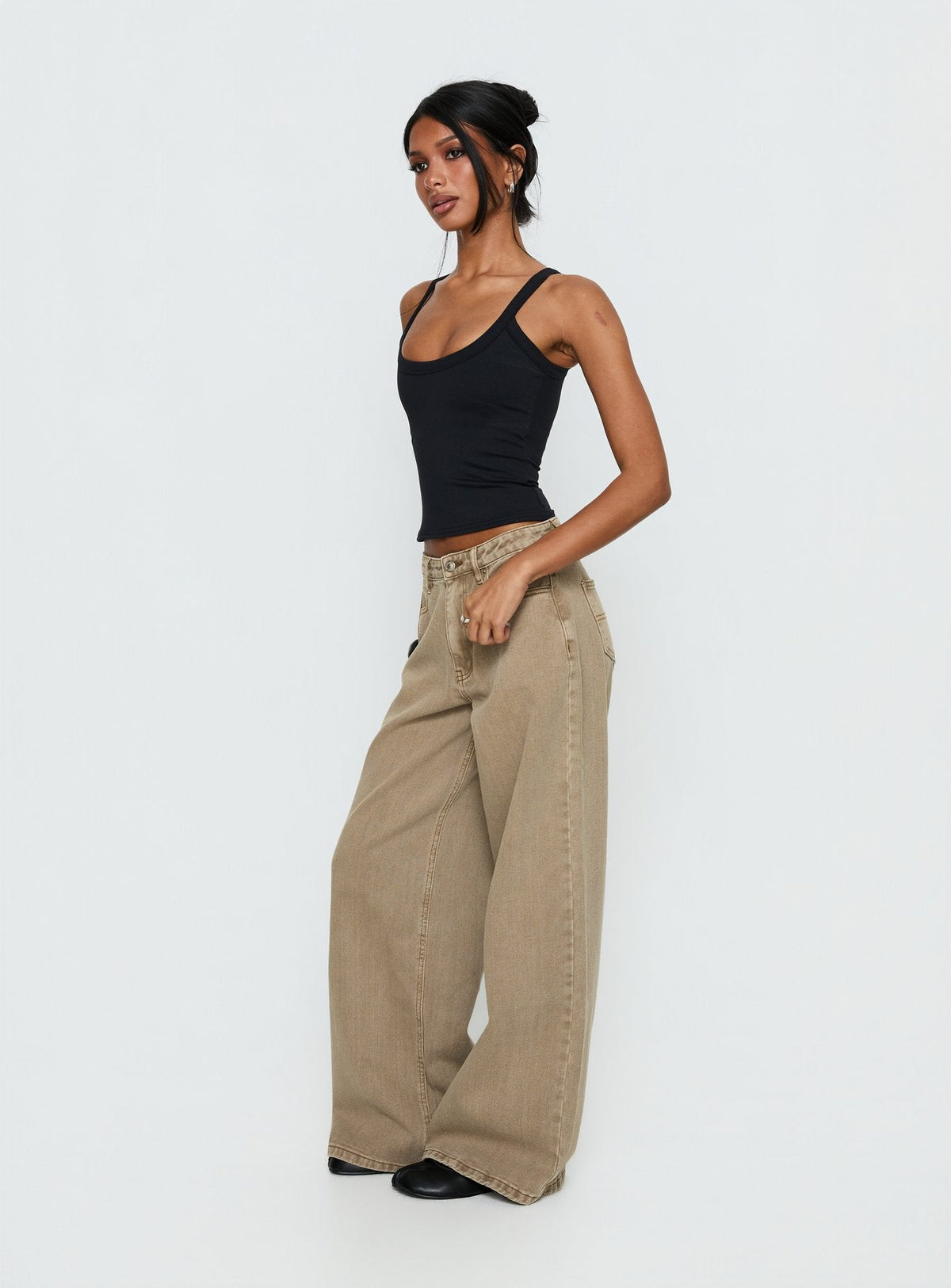 side view of model wearing Princess Polly Naylor Mid Rise Wide Leg Jeans Light Brown Wash Mid Rise Jeans Jeans 