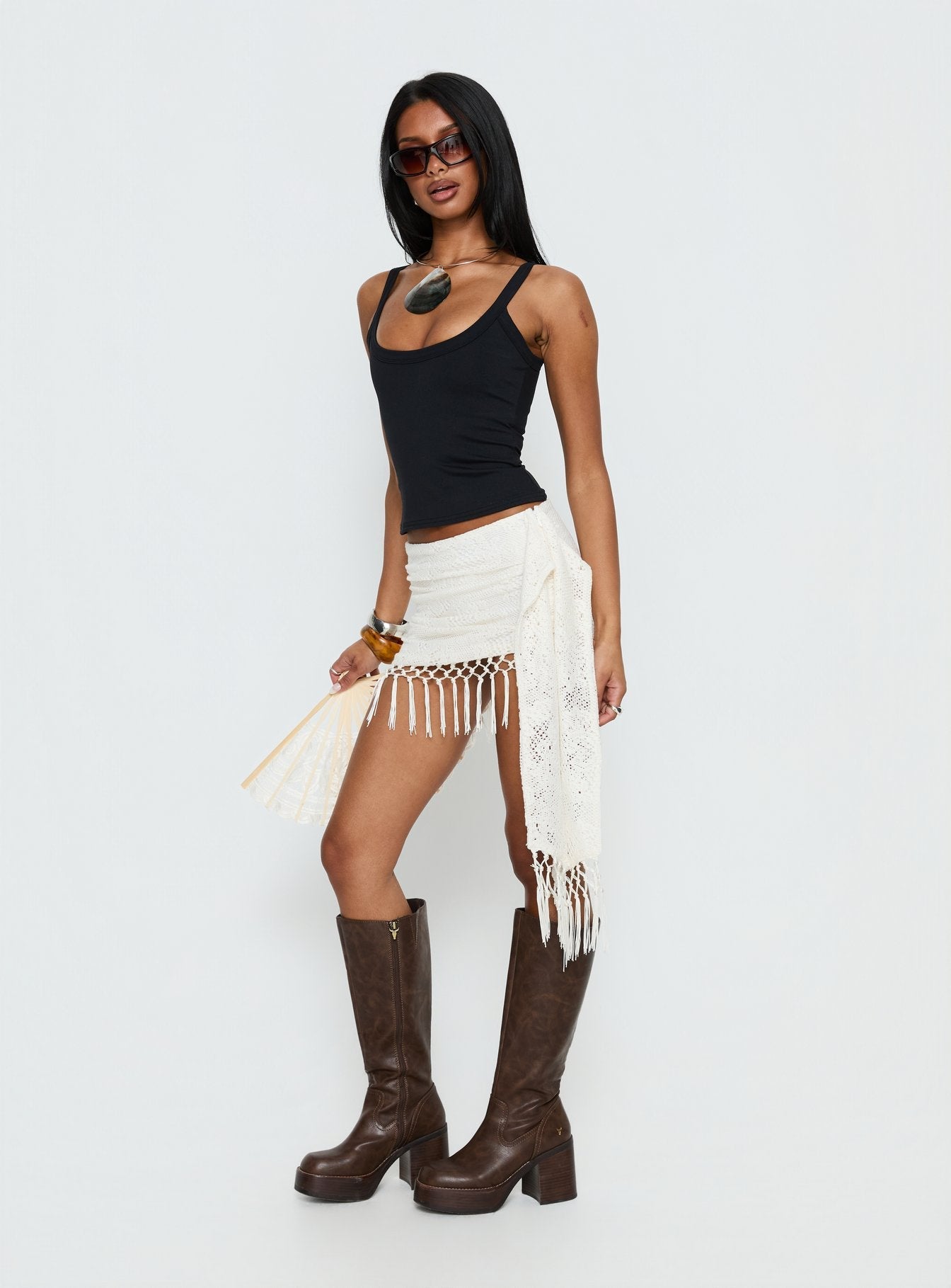   side view of model wearing Princess Polly Winita Macrame Tassel Mini Skirt Cream Mini Skirts 
