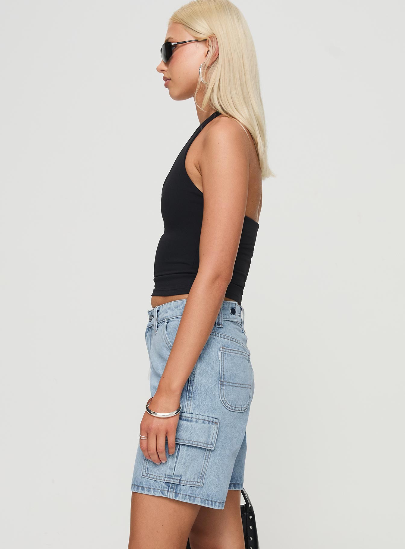 side view of model wearing Princess Polly Mika Carpenter Denim Shorts Light Wash High Waisted Shorts 