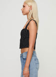 side view of model wearing Princess Polly Feed The Fire Top Black Sleeveless Sweetheart 