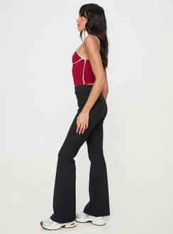 side view of model wearing Princess Polly Vasquez Flared Pants Black High Waisted Pants 