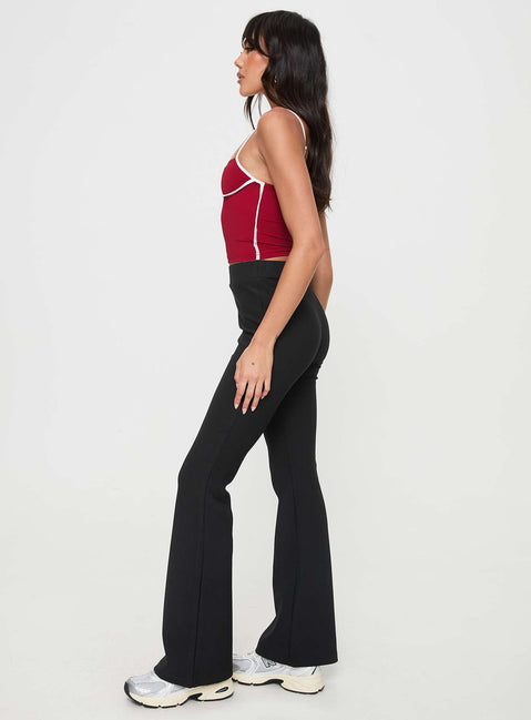 side view of model wearing Princess Polly Vasquez Flared Pants Black High Waisted Pants 