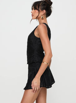   side view of model wearing Princess Polly Perilla Mini Skirt Black Mini Skirts 