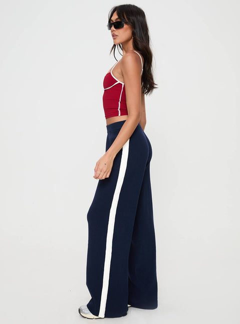 side view of model wearing Princess Polly Albright Pants Navy / Milk Mid Rise 