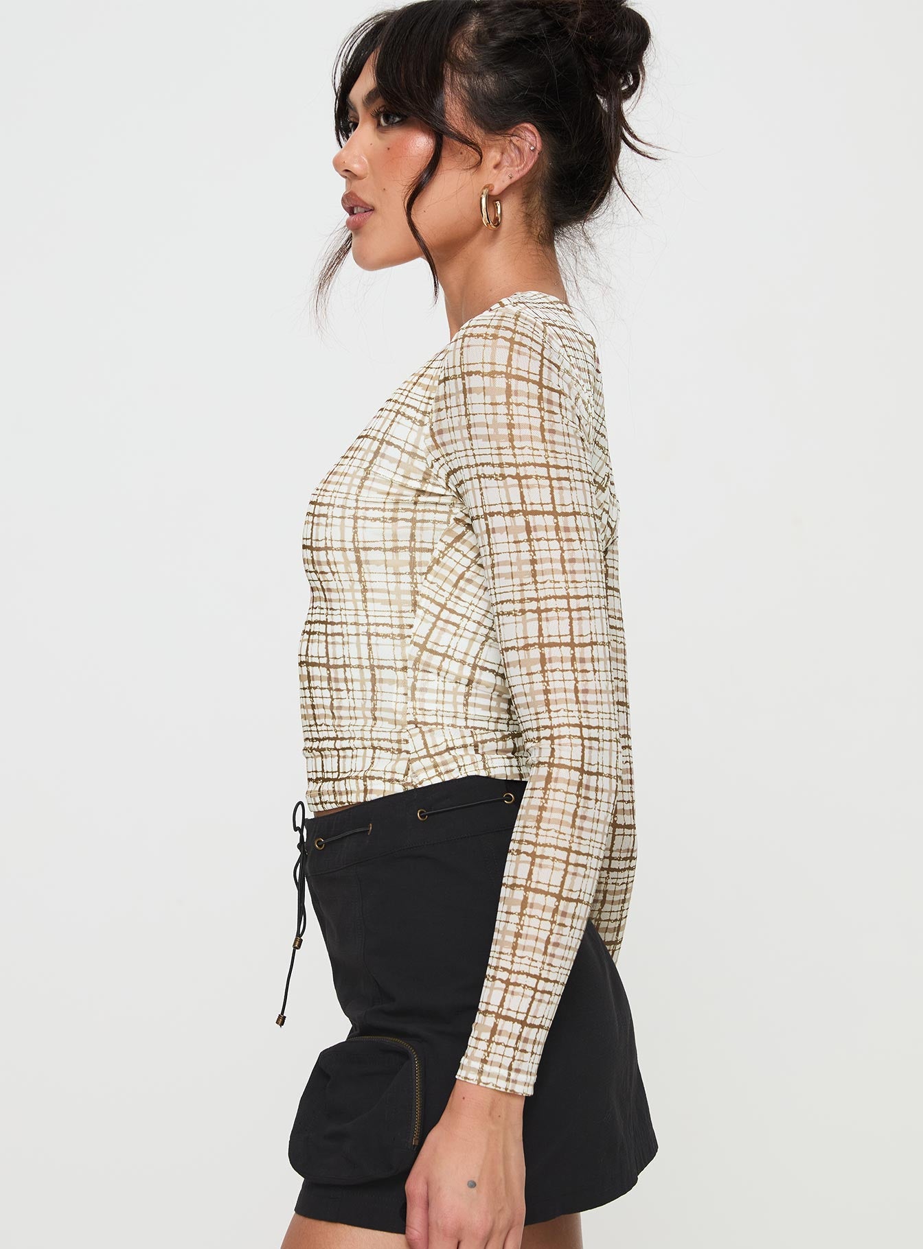 side view of model wearing Princess Polly Blissie Long Sleeve Top Beige Full Sleeves Crew Neck 