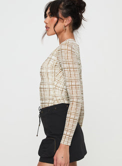 side view of model wearing Princess Polly Blissie Long Sleeve Top Beige Full Sleeves Crew Neck 