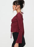 Burgundy Long sleeve top Halterneck style, v neckline, tie closure at front, split hem Good stretch, partially lined