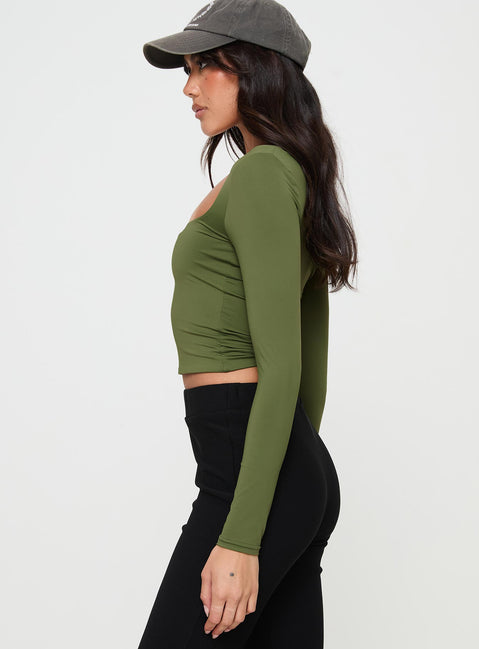 side view of model wearing Princess Polly Back In Time Long Sleeve Top Olive Full Sleeves Square Neck 