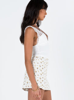   side view of model wearing Princess Polly Selby Mini Skirt White/Yellow Tall Mini Skirts 