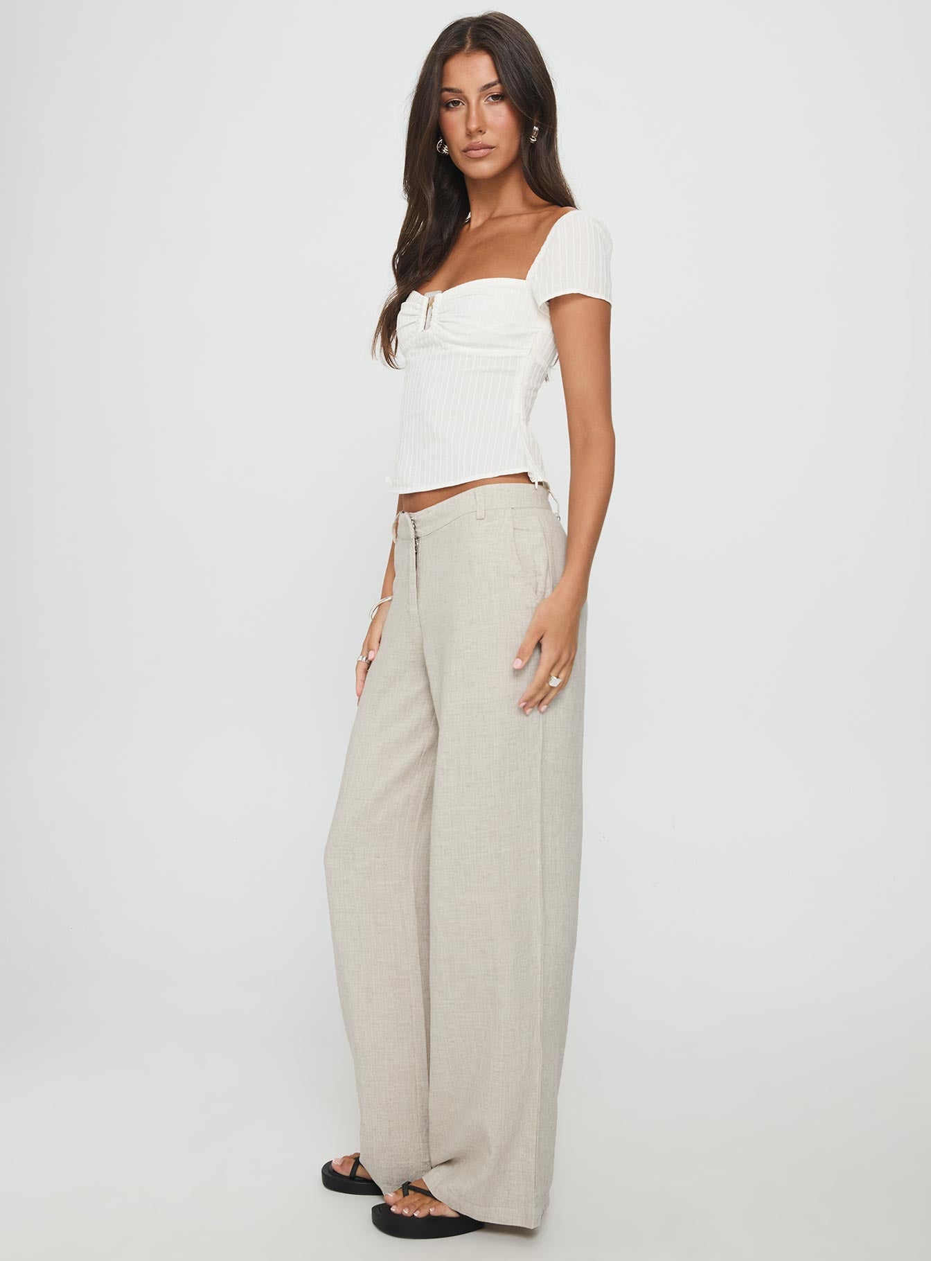 side view of model wearing Princess Polly Syrena Tailored Wide Leg Pant Natural Mid Rise Pants 