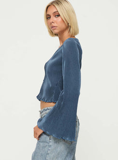 side view of model wearing Princess Polly Collis Long Sleeve Top Blue Full Sleeves V-Neck 