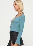 side view of model wearing Princess Polly Chantria Long Sleeve Halter Top Blue Full Sleeves Plunger 