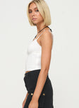 side view of model wearing Princess Polly Blame Game Top White Sleeveless V-Neck 