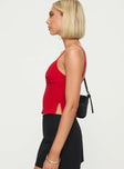 side view of model wearing Princess Polly Sculpture Top Red Sleeveless Plunger 