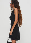 side view of model wearing Princess Polly Vivre Mini Dress Black Crew Neck 