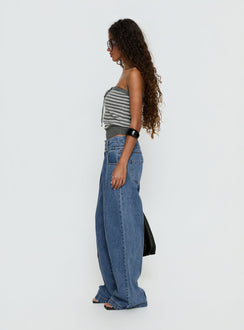 side view of model wearing Princess Polly Hannalee Low Rise Wide Leg Jeans Mid Blue Wash Low Rise Jeans 