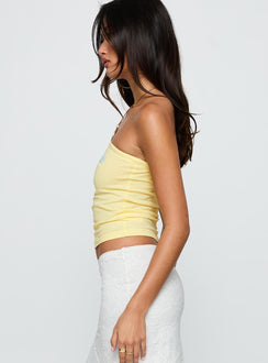 side view of model wearing Princess Polly Sorrento Italy Strapless Top Yellow Sleeveless straight 