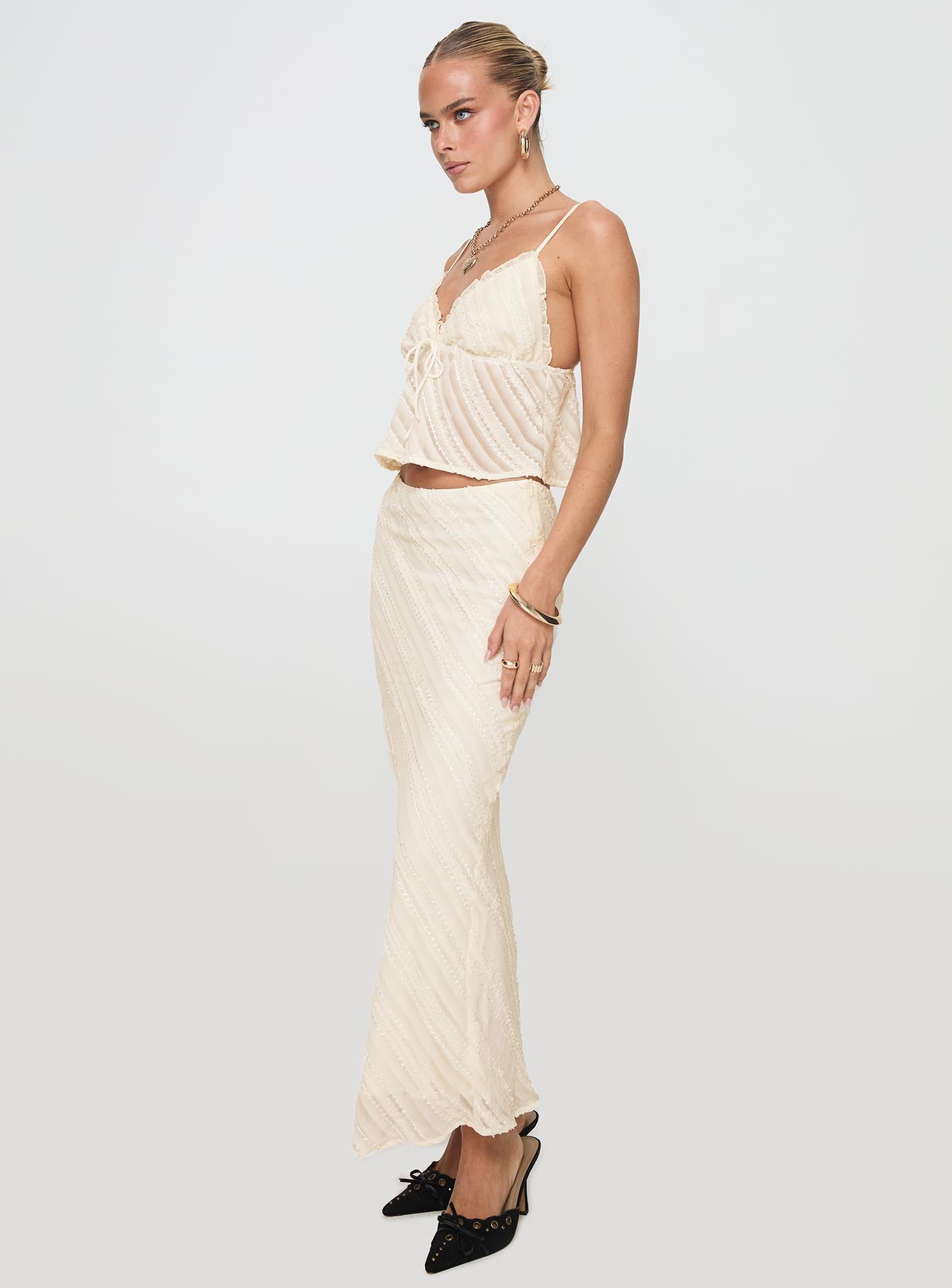   side view of model wearing Princess Polly Jacintha Maxi Skirt Cream Maxi 