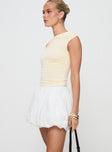   side view of model wearing Princess Polly Anglaise Bubble Hem Mini Skirt White Mini Skirts 