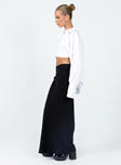   side view of model wearing Princess Polly Jodie Maxi Skirt Black Petite Maxi 