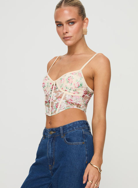 side view of model wearing Princess Polly Romania Top Cream / Floral Sleeveless Sweetheart 