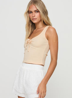 side view of model wearing Princess Polly Sixteen Tank Top Cream Sleeveless Scoop Neck 