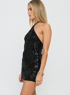   side view of model wearing Princess Polly Zelaia Shimmer Mini Skirt Black Mini Skirts 