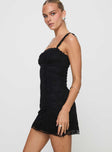 side view of model wearing Princess Polly Wignall Mini Dress Black Square Neck 