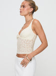 side view of model wearing Princess Polly Wandella Top Cream Sleeveless Plunger 