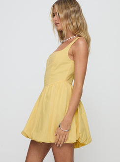 side view of model wearing Princess Polly Alcott Bubble Hem Mini Dress Lemon Square Neck 