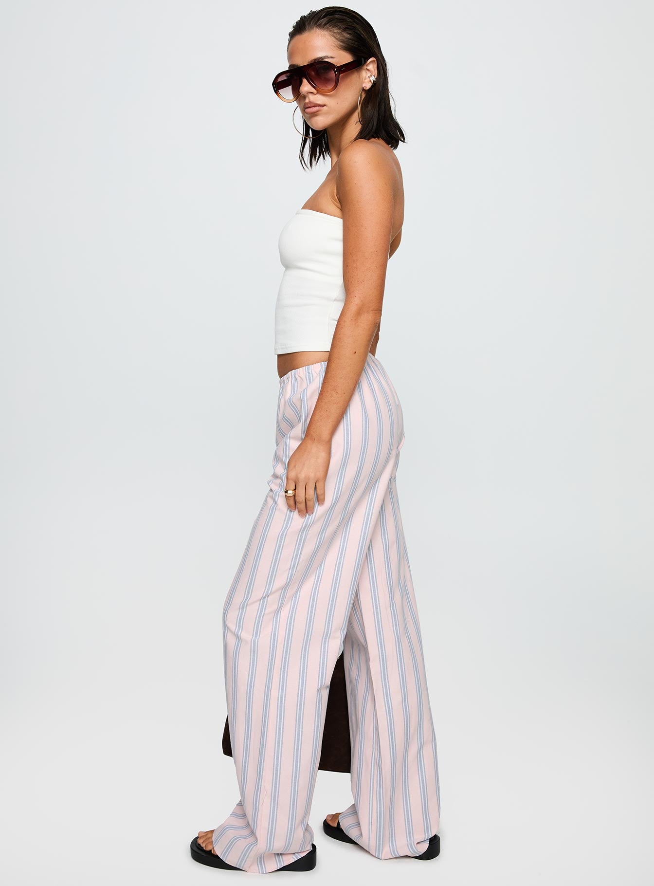 side view of model wearing Princess Polly Limestone Pants Pink Multi Low Rise Pants 