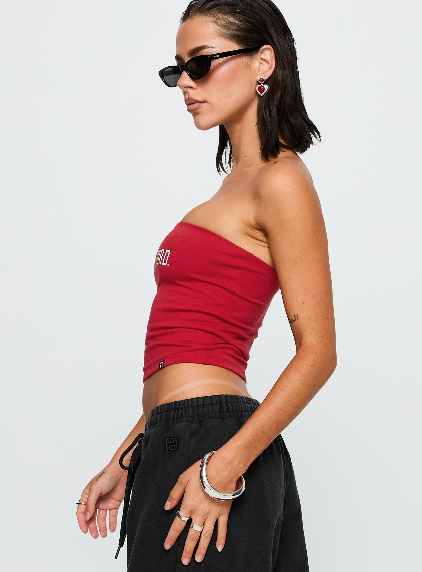side view of model wearing Princess Polly Stanford Tube Top Red Sleeveless straight 