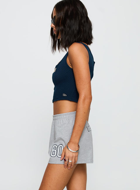 side view of model wearing Princess Polly UC San Diego Jersey Corset Top Blue Sleeveless Square Neck 