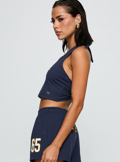 side view of model wearing Princess Polly UC Irvine Tailgate Halter Top Blue Sleeveless Scoop Neck 