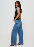 side view of model wearing Princess Polly Serenitia Mid Rise Relaxed Jeans Mid Blue Wash Mid Rise 