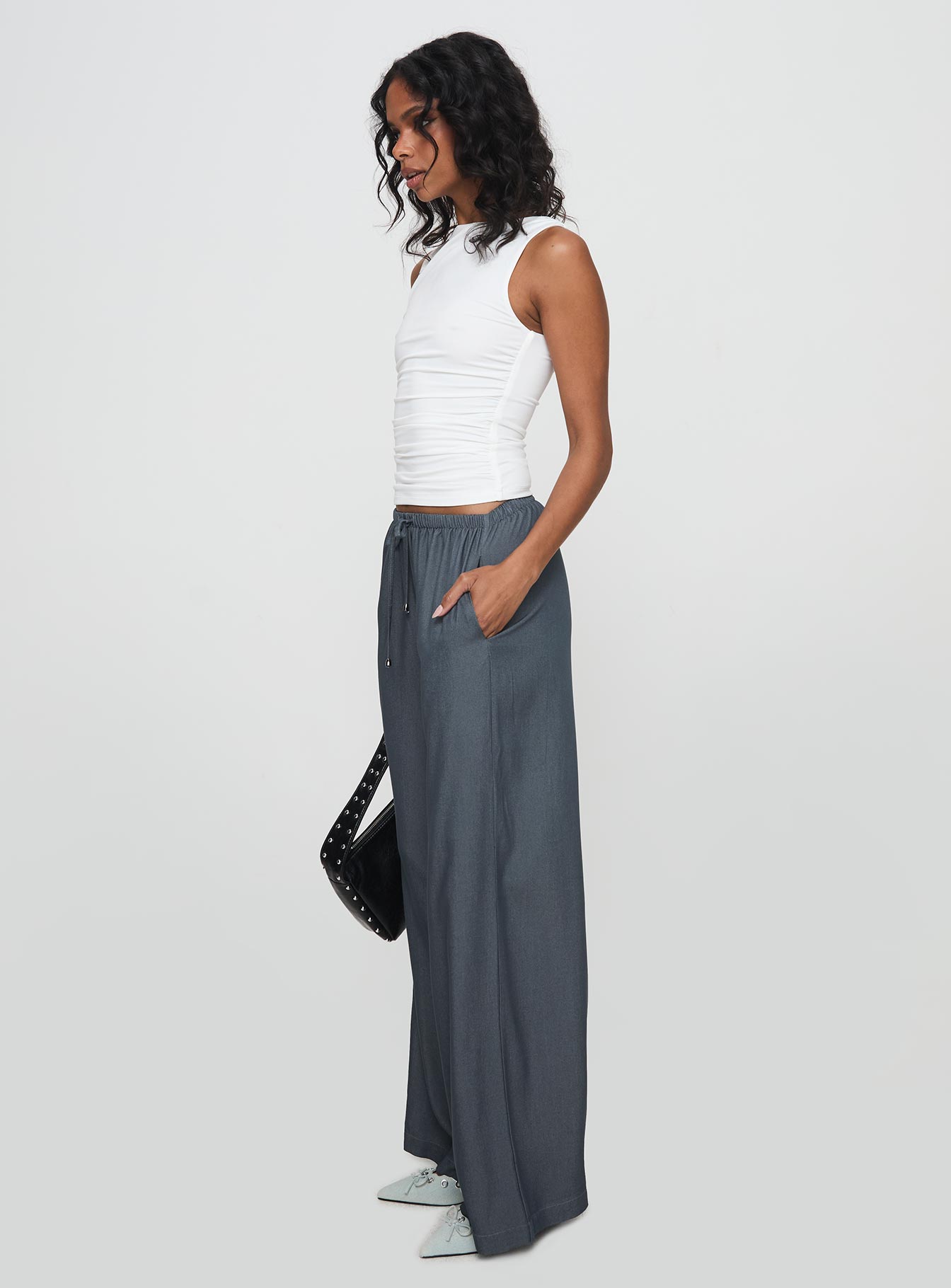 side view of model wearing Princess Polly Tallilah Pants Dark Chambray High Waisted Pants 