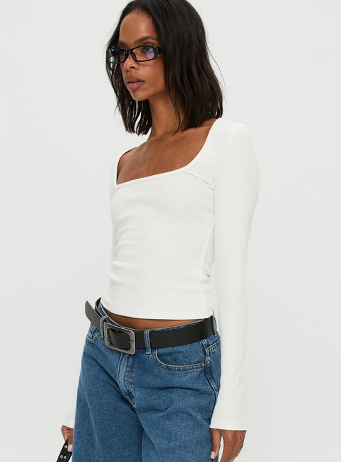 side view of model wearing Princess Polly Baseline Rib Long Sleeve Top White Full Sleeves Scoop Neck 