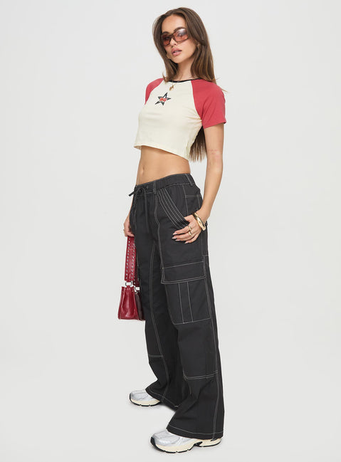side view of model wearing Princess Polly Soria Cargo Pants Black Low Rise Pants 