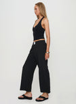 side view of model wearing Princess Polly Beach House Pants Black Low Rise Pants 