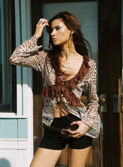 front view of model wearing Princess Polly Domanic Frill Top Leopard Full Sleeves Plunger 