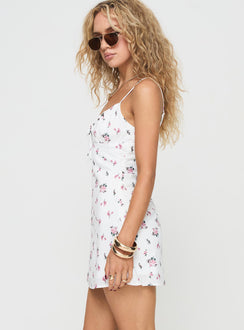 side view of model wearing Princess Polly Perries Mini Dress White Floral Sweetheart Neckline 
