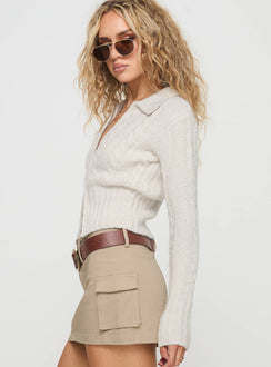 side view of model wearing Princess Polly Jeller Zip Front Knit Sweater Beige Cropped 