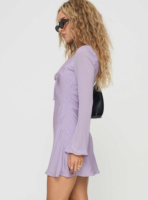 side view of model wearing Princess Polly Sorrento Long Sleeve Mini Dress Purple Scoop Neck 