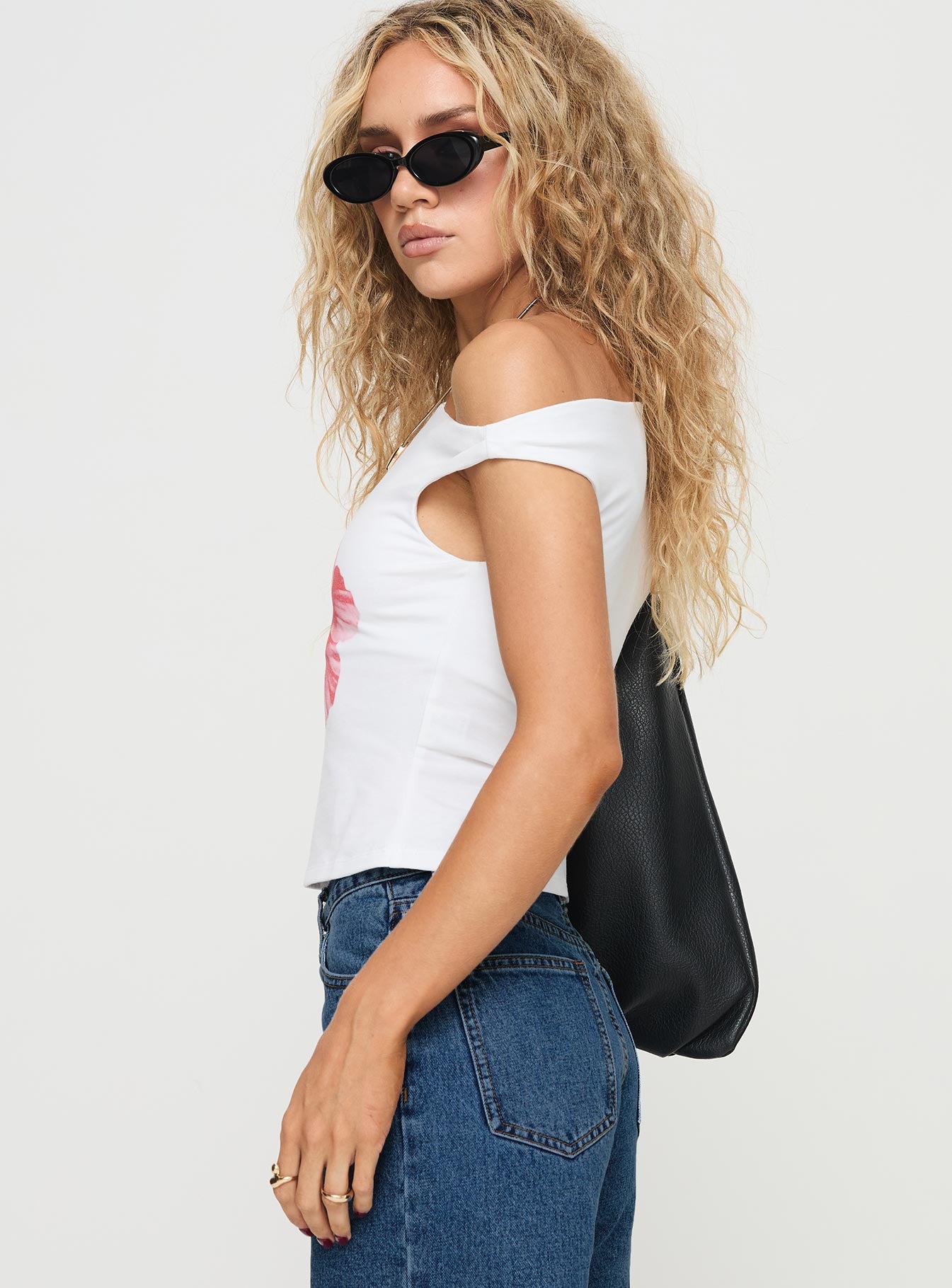 side view of model wearing Princess Polly Edwardi Hibiscus Top White Sleeveless Asymmetric Neckline 