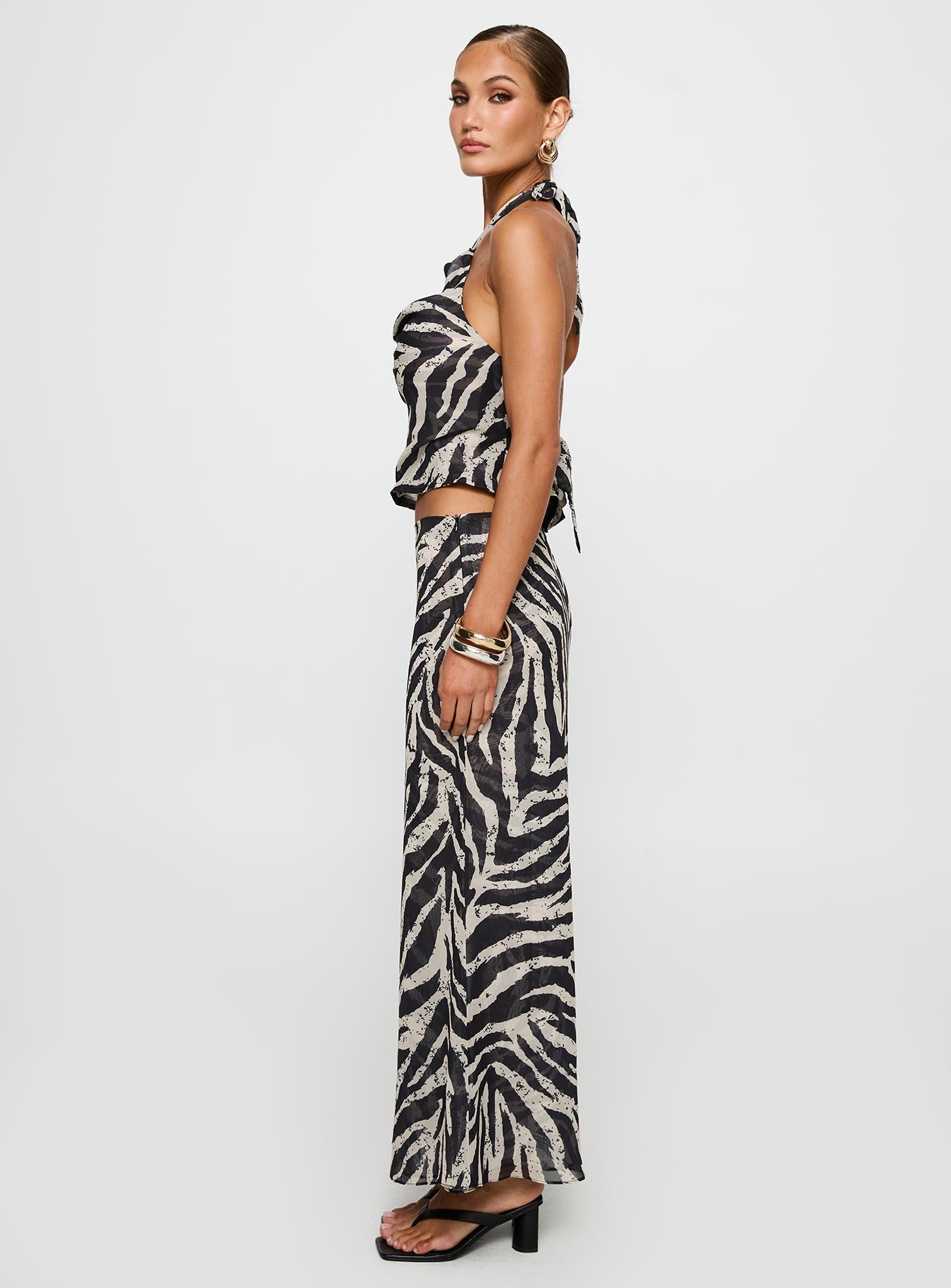   side view of model wearing Princess Polly Eleganza Maxi Skirt Zebra Maxi 