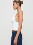 side view of model wearing Princess Polly Whimsy Halter Top White Sleeveless Plunger 