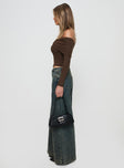 side view of model wearing Princess Polly Ziggie Low Rise Ultra Baggy Jeans Antique Wash Low Rise Jeans 